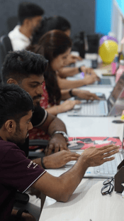 Tekvocation digital marketing interns engaged in hands-on training at the office.